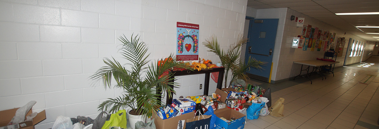 front lobby, school alter, boxes of food for donation